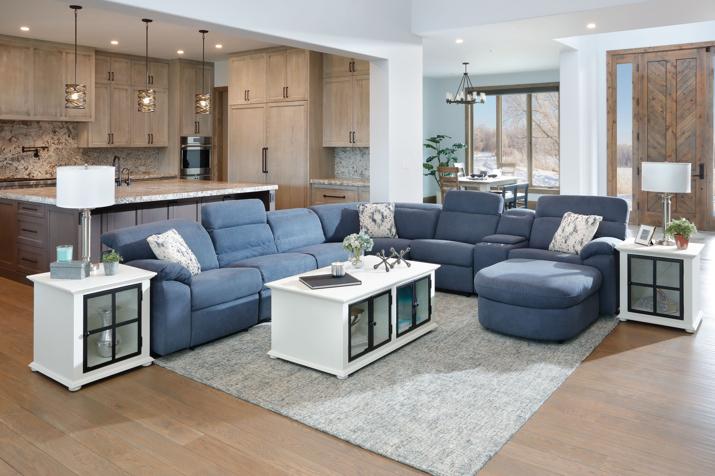 Blue Sectional with storage chaise, adjustable head rests, and extra pull out seating.