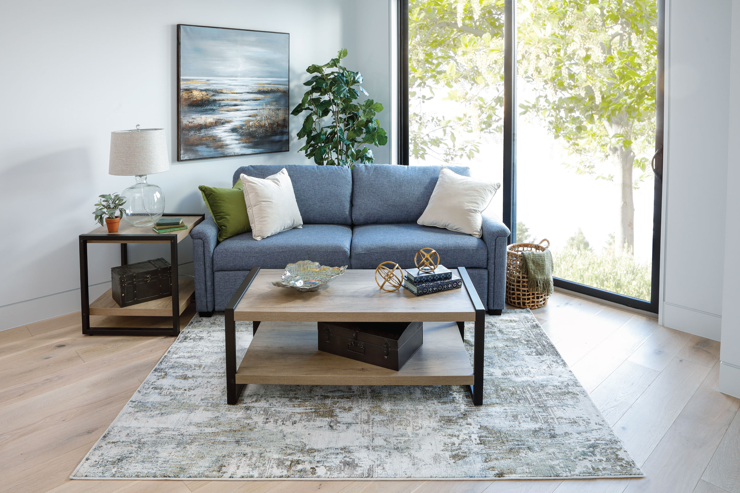 Blue 2 Seater Sofa with clean lined open coffee table and side table